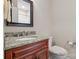 Small bathroom with granite vanity and a single sink at 8466 Benton Ct, Denver, NC 28037