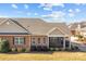 Brick ranch home with screened porch and landscaping at 8466 Benton Ct, Denver, NC 28037