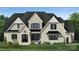 Two-story house with gray stone and black shutters at 01 Mcfalls Dr, Indian Land, SC 29707