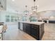 Open kitchen with large island and access to living area at 01 Mcfalls Dr, Indian Land, SC 29707