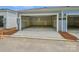 A spacious two-car garage with concrete floors and drywall, offering ample parking and storage space at 10115 Mamillion Dr, Huntersville, NC 28078