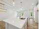 Modern kitchen island with quartz countertops, gold accents, and stainless steel appliances at 10115 Mamillion Dr, Huntersville, NC 28078