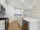 Well-equipped kitchen features an island, stainless steel appliances, and stylish tile backsplash at 10115 Mamillion Dr, Huntersville, NC 28078