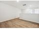 Bright upstairs loft area featuring wood-look flooring, fresh paint and a hallway view at 10115 Mamillion Dr, Huntersville, NC 28078