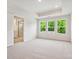 Tranquil bedroom showcasing recessed ceiling, plush carpet, and an ensuite bathroom at 10115 Mamillion Dr, Huntersville, NC 28078