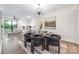 Modern dining room featuring stylish chairs, a glass-top table, contemporary lighting, and an elegant rug at 111 Verbena Ne St # 10, Charlotte, NC 28217