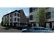Contemporary townhomes feature stylish exteriors, blending modern design with a touch of natural greenery at 111 Verbena Ne St # 10, Charlotte, NC 28217