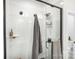 Modern shower with grey tile and glass enclosure features sleek fixtures and a convenient towel rack at 111 Verbena Ne St # 10, Charlotte, NC 28217