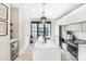 Contemporary kitchen featuring a center island, stylish pendant lighting, and stainless steel appliances at 111 Verbena Ne St, Charlotte, NC 28217