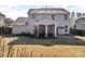 Large backyard includes a screened porch and lush greenery, perfect for outdoor activities and relaxation at 1148 Mckee Farm Ln, Belmont, NC 28012