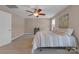 Comfortable bedroom with carpet flooring, ceiling fan, and natural light at 1148 Mckee Farm Ln, Belmont, NC 28012