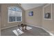 Bright bedroom with a large window, plenty of light, and neutral carpet at 1148 Mckee Farm Ln, Belmont, NC 28012