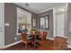 Charming dining area with a round table, four chairs, and natural light at 1148 Mckee Farm Ln, Belmont, NC 28012