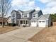 Charming two-story home with a two-car garage and covered porch, perfect for enjoying the outdoors at 1148 Mckee Farm Ln, Belmont, NC 28012
