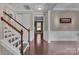Inviting foyer with hardwood floors, a staircase, and views of the living spaces at 1148 Mckee Farm Ln, Belmont, NC 28012