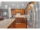 Well-equipped kitchen with stainless steel appliances, granite countertops, and ample cabinetry at 1148 Mckee Farm Ln, Belmont, NC 28012
