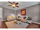 Cozy living room features hardwood floors, ceiling fan, and tasteful decor at 1148 Mckee Farm Ln, Belmont, NC 28012