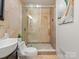 Tiled bathroom with a glass shower and a modern vanity at 122 Lansdowne Rd, Charlotte, NC 28270