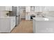 Well-lit kitchen with stainless steel appliances, white cabinets, and ample counter space at 122 Lansdowne Rd, Charlotte, NC 28270
