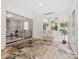 Bright sunroom featuring tile floors, white walls, and natural light at 122 Lansdowne Rd, Charlotte, NC 28270