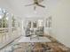 Inviting sunroom featuring tile flooring, ample natural light, and comfortable seating at 122 Lansdowne Rd, Charlotte, NC 28270