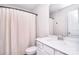 Clean bathroom featuring white vanity with modern sink and a shower with textured curtain at 124 Doncaster Dr, Mooresville, NC 28115