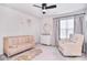 Bedroom with a wooden crib, white dresser, and a comfortable chair at 124 Doncaster Dr, Mooresville, NC 28115