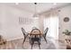 This dining room has a round table, four chairs, neutral decor, and lots of natural light at 124 Doncaster Dr, Mooresville, NC 28115