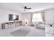 Living room with a large television, couch, rug and a play tent at 124 Doncaster Dr, Mooresville, NC 28115