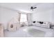 Bright living room with a comfortable sectional sofa, modern ceiling fan, and neutral decor at 124 Doncaster Dr, Mooresville, NC 28115