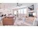 Spacious living room featuring fireplace, ceiling fan and ample seating at 124 Doncaster Dr, Mooresville, NC 28115