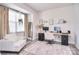 Bright home office space with work area, chair, and a relaxing armchair near a window at 124 Doncaster Dr, Mooresville, NC 28115