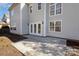 Exterior view of a house with a big concrete patio and neutral colored siding at 132 Elizabeth Hearth Rd, Mooresville, NC 28115