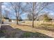 Spacious backyard with a wooden privacy fence and large mature trees at 132 Elizabeth Hearth Rd, Mooresville, NC 28115