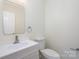 Elegant powder room featuring a modern vanity, sink, and toilet at 132 Elizabeth Hearth Rd, Mooresville, NC 28115