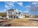 Inviting two-story home with a three-car garage, lovely curb appeal in established neighborhood at 132 Elizabeth Hearth Rd, Mooresville, NC 28115