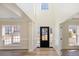 Bright and airy foyer with high ceilings, hardwood floors, and natural light at 132 Elizabeth Hearth Rd, Mooresville, NC 28115