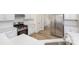 Stainless steel appliances, light granite countertops, and light wood floors enhance the contemporary design at 132 Elizabeth Hearth Rd, Mooresville, NC 28115