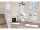 Bright and spacious living room with a fireplace, high ceilings and large windows at 132 Elizabeth Hearth Rd, Mooresville, NC 28115