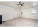 Spacious main bedroom with a tray ceiling, fireplace, and neutral carpet at 132 Elizabeth Hearth Rd, Mooresville, NC 28115