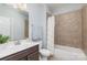 Clean bathroom with single vanity and tub at 1320 Torrens Dr, Wesley Chapel, NC 28110