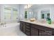 Double vanity bathroom with granite countertop and soaking tub at 1320 Torrens Dr, Wesley Chapel, NC 28110