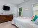 Guest bedroom with a dresser and full-size bed at 1320 Torrens Dr, Wesley Chapel, NC 28110