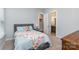 Bright bedroom with a queen bed and en-suite bathroom access at 1320 Torrens Dr, Wesley Chapel, NC 28110