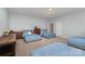 Spacious bedroom with three twin beds and dresser at 1320 Torrens Dr, Wesley Chapel, NC 28110
