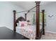 Bedroom with a four-poster bed and window at 1320 Torrens Dr, Wesley Chapel, NC 28110