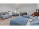 Large bedroom with three twin beds and ample storage at 1320 Torrens Dr, Wesley Chapel, NC 28110
