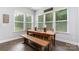 Breakfast nook with a rustic wooden table and bench at 1320 Torrens Dr, Wesley Chapel, NC 28110
