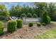 Adelaide Estates entrance with stone sign and landscaping at 1320 Torrens Dr, Wesley Chapel, NC 28110