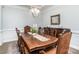 Formal dining room with a large wood table and matching chairs at 1320 Torrens Dr, Wesley Chapel, NC 28110